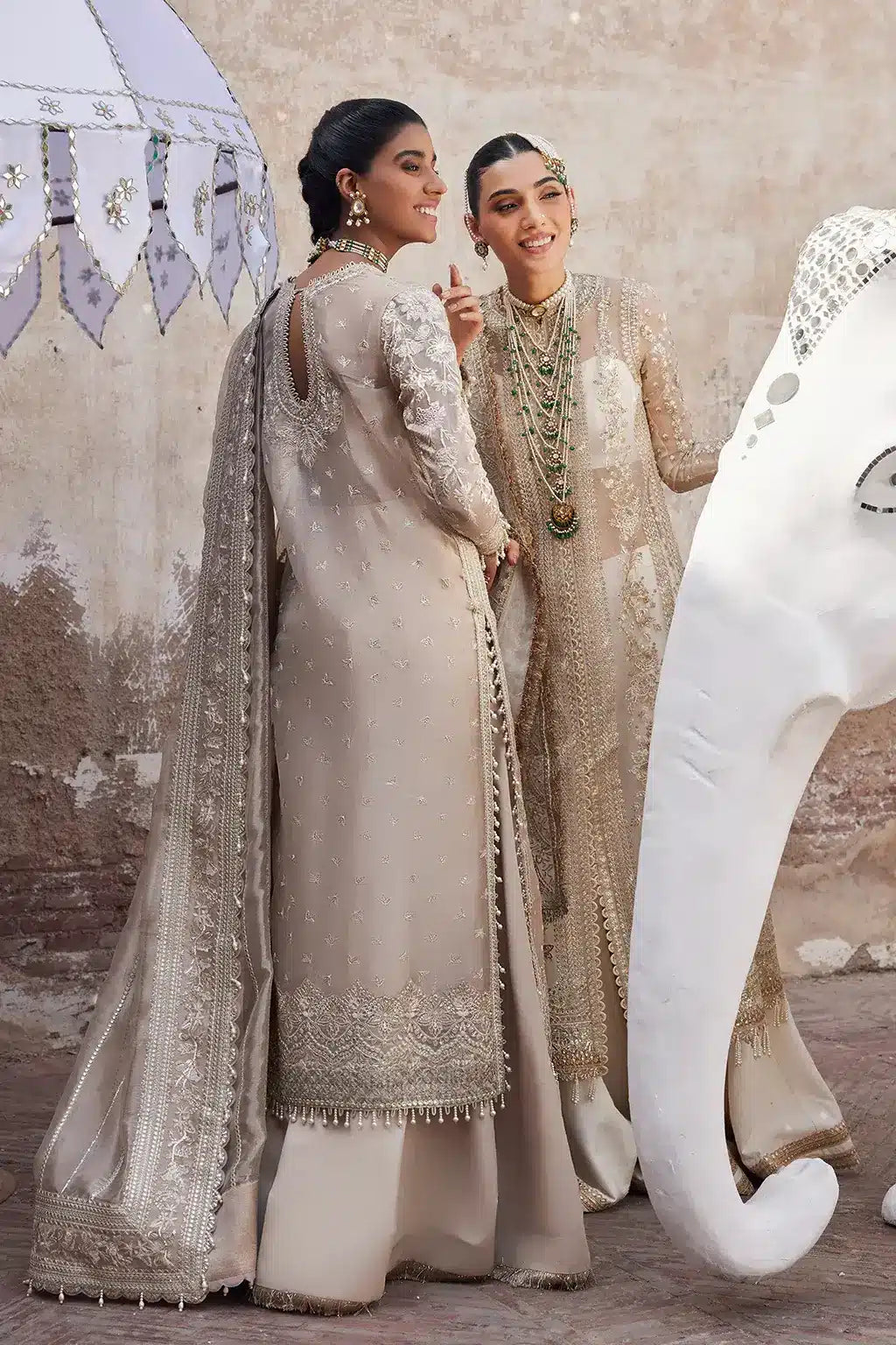 Afrozeh Dastangoi Wedding Formals Ulfat – Ivory Pakistani Dress with intricate embroidery and embellishments. Shop elegant Asian dresses at Maria Faisal.
