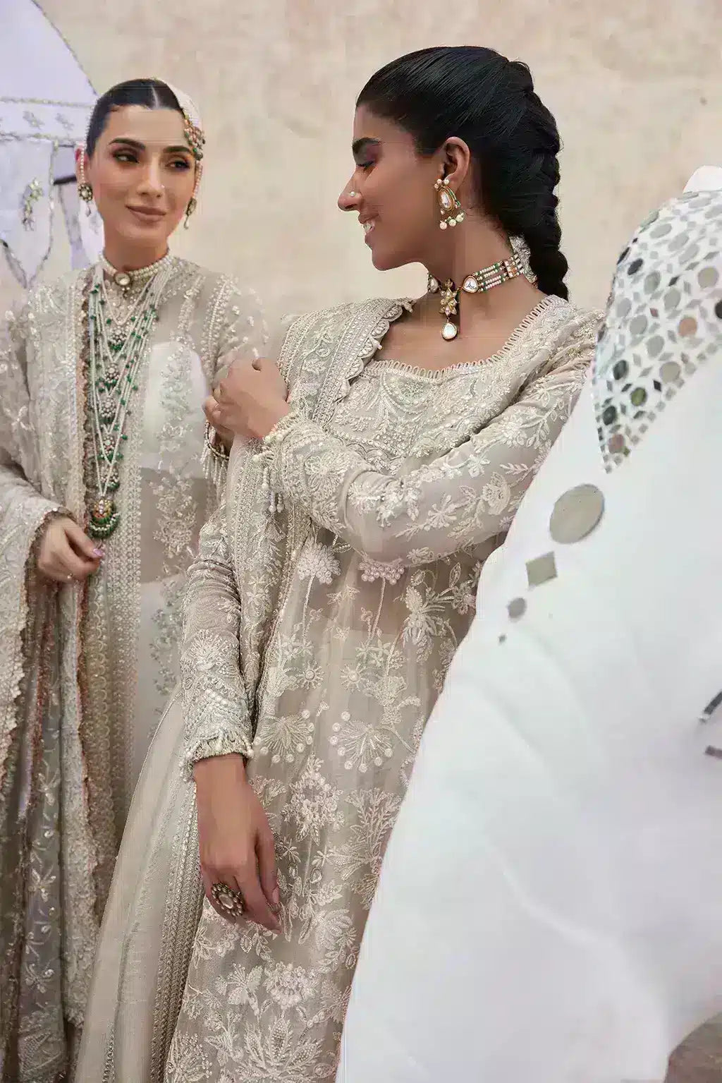 Afrozeh Dastangoi Wedding Formals Ulfat – Ivory Pakistani Dress with intricate embroidery and embellishments. Shop elegant Asian dresses at Maria Faisal.